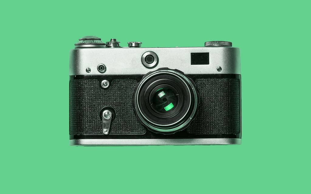 Camera on a green background